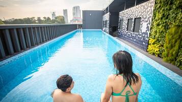 Outdoor pool, open 7:00 AM to 9:00 PM, pool loungers