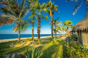 On the beach, sun loungers, beach towels