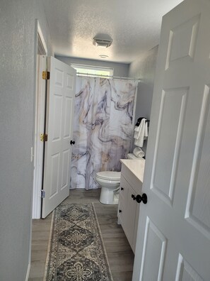 Shower, hair dryer, towels, soap