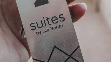 A tag with the number 2 and the text "Suites by Isla Verde".