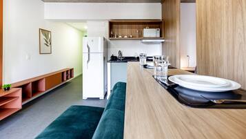 Fridge, microwave, coffee/tea maker, cookware/dishes/utensils