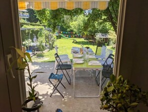 Enjoy a serene view of the garden from the comfort of your room, with access to a beautifully maintained outdoor space.