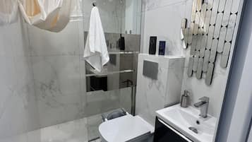 Shower, towels, soap, shampoo