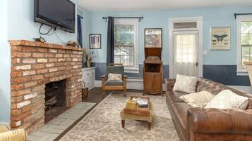 TV, fireplace, books