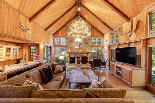 Expansive estate with hot tub, putting green, gourmet kitchen, & fireplaces