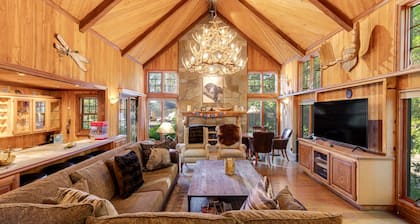 Expansive estate with hot tub, putting green, gourmet kitchen, & fireplaces