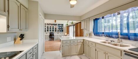 Fridge, stovetop, dishwasher, coffee/tea maker