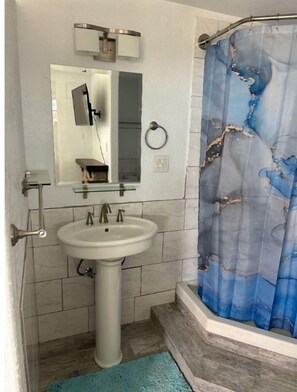 Combined shower/tub, hair dryer, towels, soap