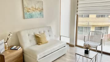 Luxury Apartment | Living area | 42-inch LED TV with satellite channels