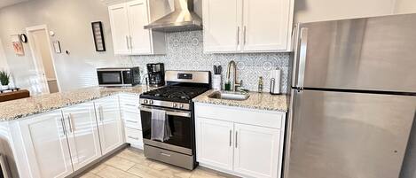 Fridge, microwave, stovetop, coffee/tea maker