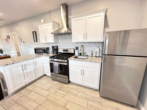 Fridge, microwave, stovetop, coffee/tea maker - Chic Tiny Brick Home: Remodeled Unit 1
(El Paso)