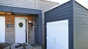 A two-car garage with a white door and a number plate '22'. - Gorgeous home in Tossens with sauna (Tossens)