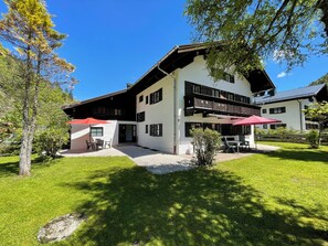 Stunning two-story building with a traditional balcony and serene surroundings.