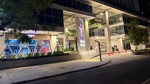 A multi-story building with a modern architectural design, featuring large windows and a central atrium. - Comfortable and nice Apartment in City of  Guatemala  (Ciudad de Guatemala)