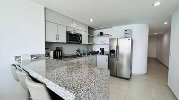 Fridge, microwave, stovetop, coffee/tea maker