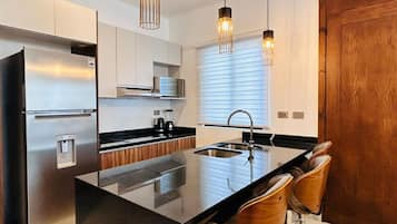 Fridge, microwave, stovetop, coffee/tea maker