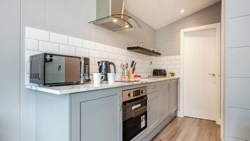 Fridge, toaster, cookware/dishes/utensils