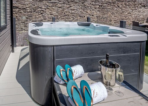 Experience ultimate luxury with the brand-new Faraday lodge with hot tub.
