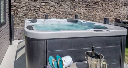 Experience ultimate luxury with the brand-new Faraday lodge with hot tub.