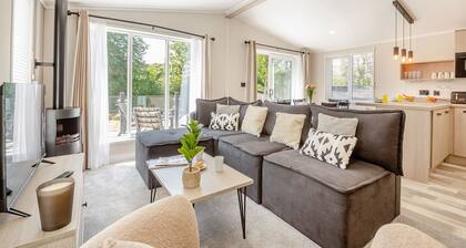 Experience ultimate luxury with the brand-new Faraday lodge with hot tub.