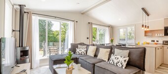 Experience ultimate luxury with the brand-new Faraday lodge with hot tub.