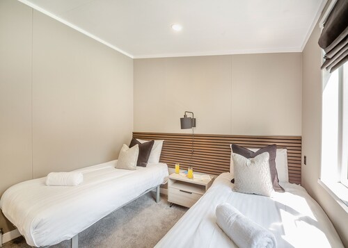 Experience ultimate luxury with the brand-new Faraday lodge with hot tub.