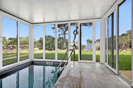 Indoor pool, a heated pool. Holiday Home "Rocha do Mar 1" with Sea View, Shared Pool & Wi-Fi