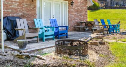 Charming lakefront retreat with cozy interiors, private dock, fire pit, and breathtaking water view