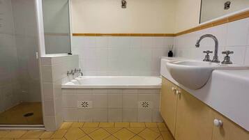 Bathtub, hair dryer, towels