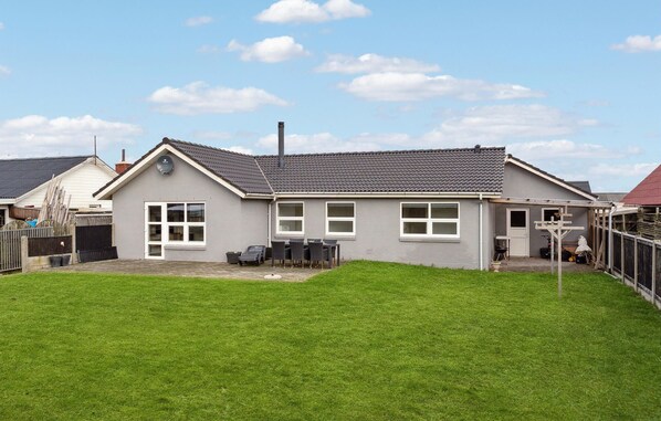 Enjoy a home away from home with a patio and well-maintained lawn.
