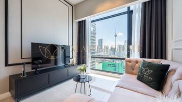 Deluxe Suite, 2 Bedrooms, Non Smoking | Living area | 42-inch Smart TV with digital channels, Netflix, streaming services