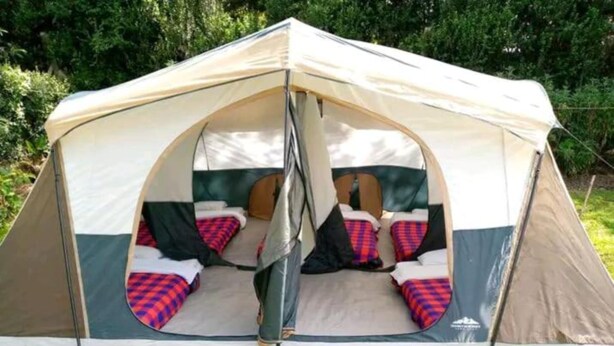 A tent with two sleeping areas, each with a mattress and pillows. - Sofa Camp Naivasha (Naivasha)