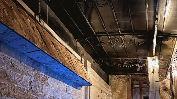 A swimming pool with a stone wall and a wooden ceiling. - Prestige Terrace Hotel (Bukhara)