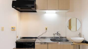 Family Apartment | Private kitchen | Full-sized fridge, microwave, stovetop, electric kettle