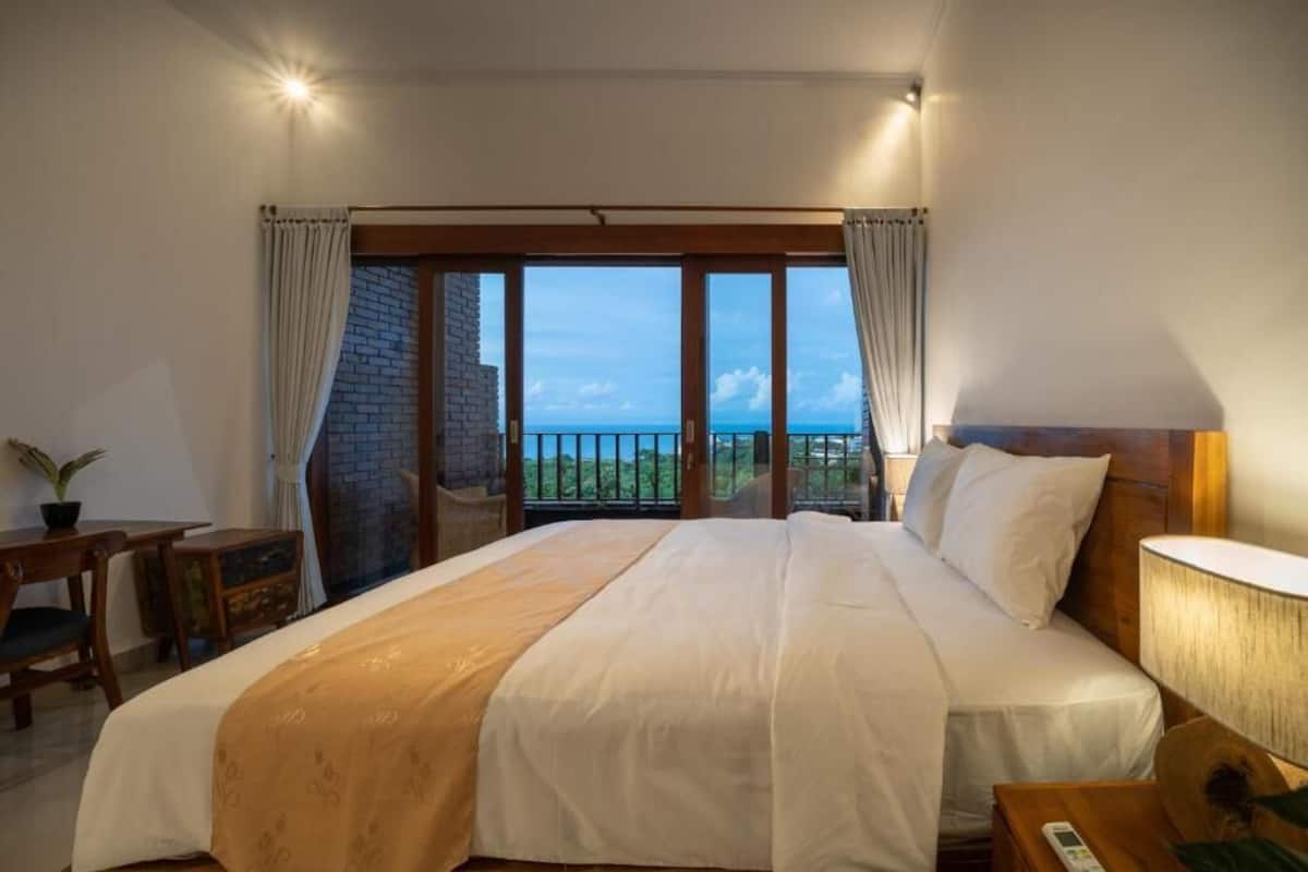 Deluxe Room, 1 Bedroom, Sea View | 1 bedroom, minibar, desk, laptop workspace