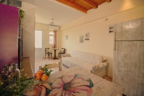 Standard House, Multiple Bedrooms, 2 Bathrooms, Mountainside (Evgenias House Ancient Olympia) | Living area | 21-inch flat-screen TV with cable channels, TV - Evgenias House Ancient Olympia (Archaia Olympia)