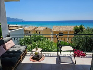 Enjoy the breathtaking sea views and serene mountain vistas from this balcony.
