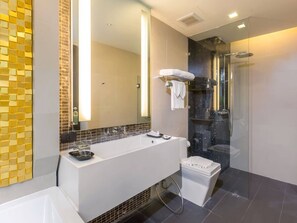 Bathtub, hair dryer, towels, soap