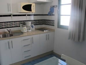 Microwave, stovetop, coffee/tea maker, toaster