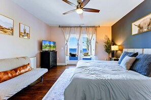 Suite with king bed, bathroom, and walkout patio. - Huge 8BR Lakefront Lake Anna, Beach, Dock, Hot Tub (Bumpass)