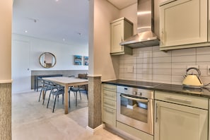 Fridge, microwave, oven, stovetop - Two Bedroom Apartment - fully furnished and design in V&a Marina Residential (Cape Town)