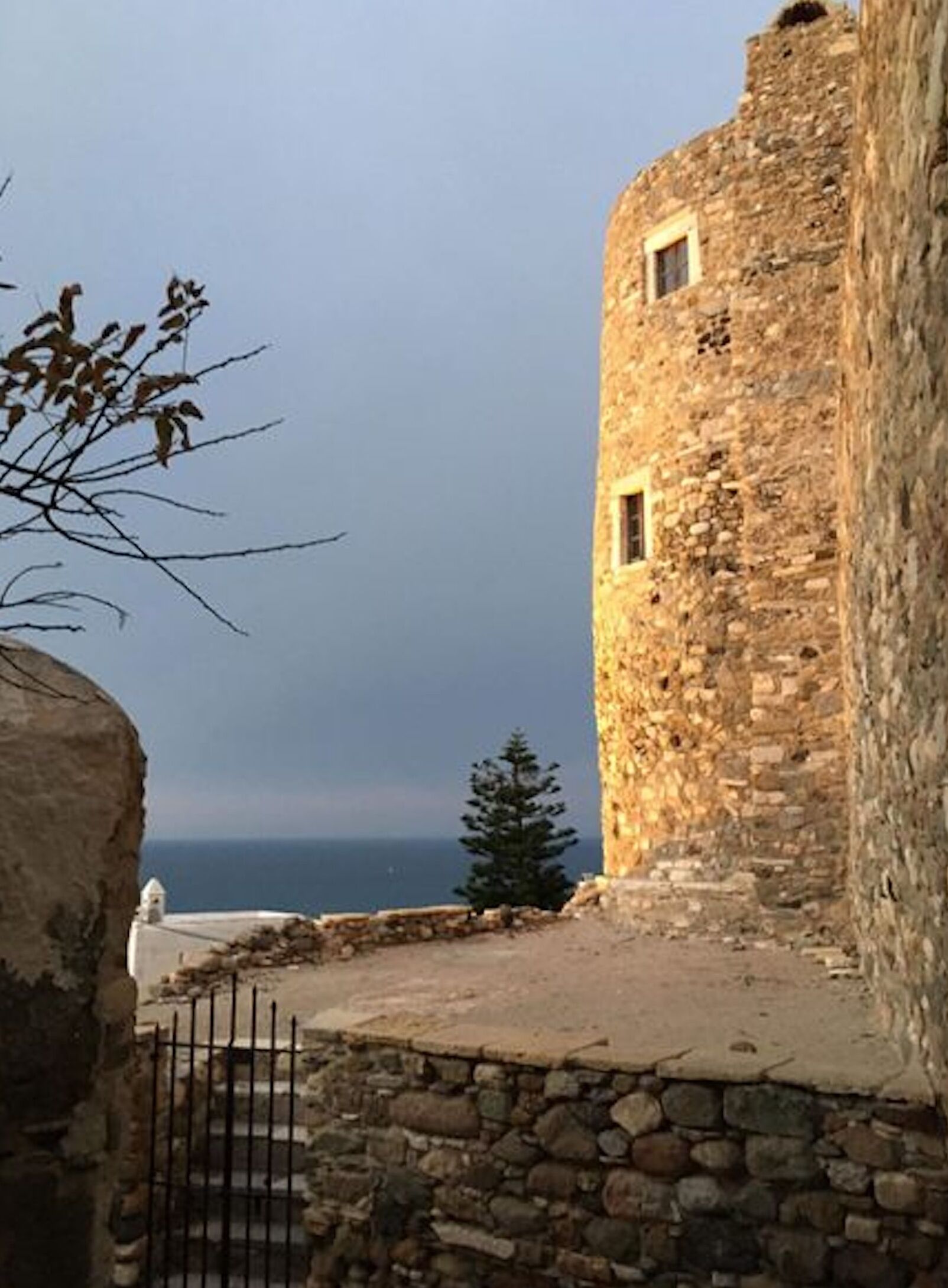 A stone building with a view of the sea.