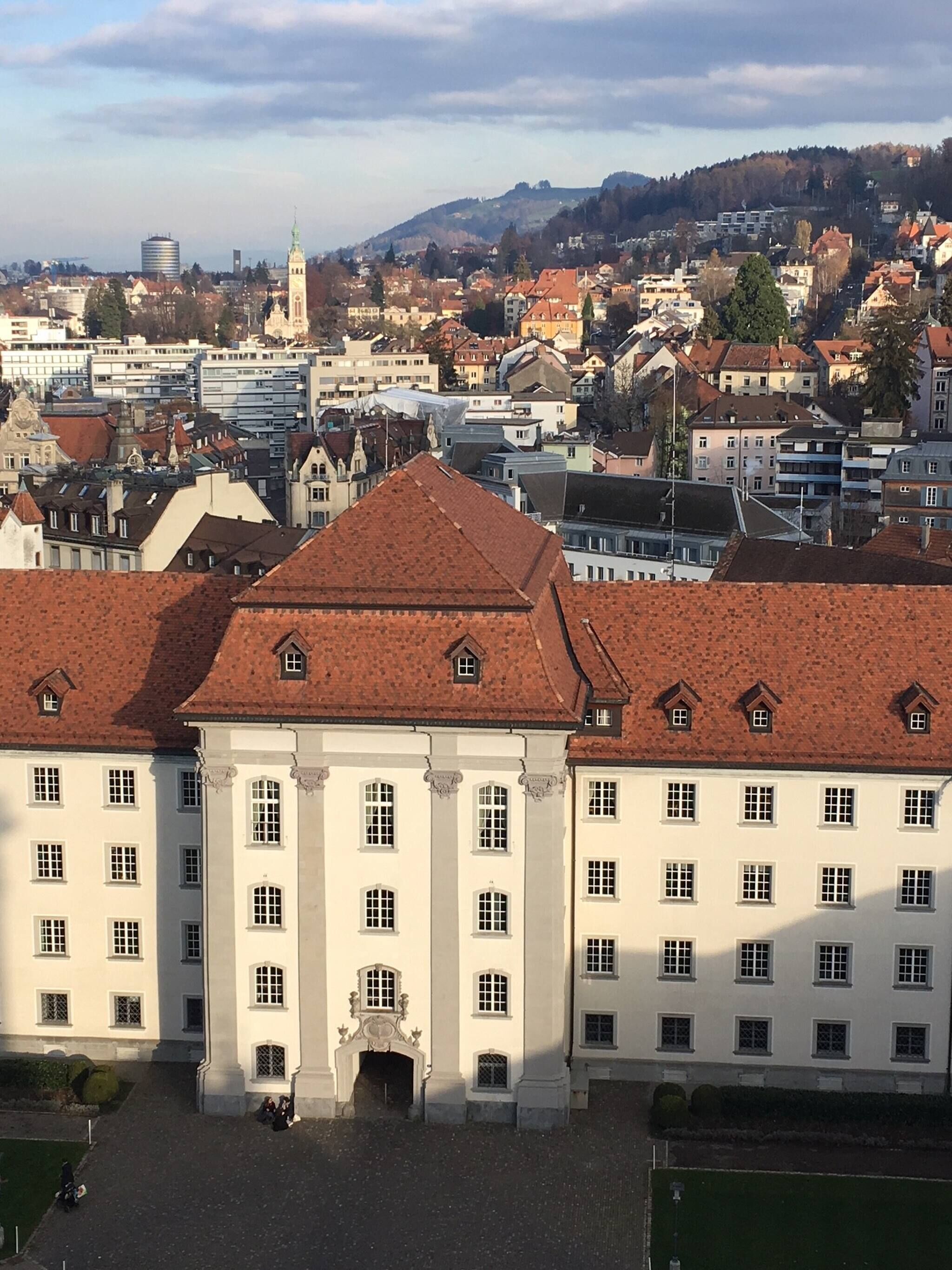 A large, historic building with a symmetrical facade, multiple windows, and a central entrance.