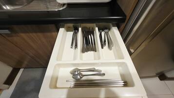 A kitchen drawer with utensils neatly organized.