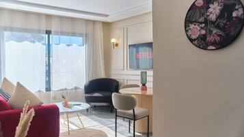 Superior Apartment | Living area | 105-cm Smart TV with digital channels, Netflix, first-run movies