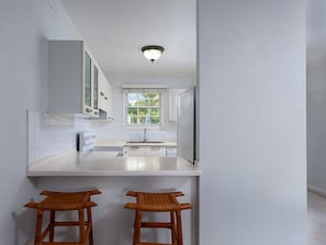 Enjoy cooking in this kitchen with an oven and window for natural light.