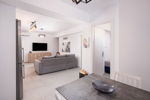 Economy Apartment, Private Bathroom | Living area | 55-inch Smart TV with digital channels, Netflix, streaming services - Hosting Moments Semi Basement Apartment (Mykonos)
