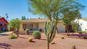 A house with a desert garden featuring cacti and small trees. - Phoenix Home w/ Patio: Near Downtown & Light Rail! (Phoenix)