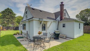 A single-story house with a patio, a grill, and a satellite dish. - Private Plainfield Retreat w/ Gas Grill + Patio (Plainfield)