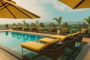 Outdoor pool, pool umbrellas, pool loungers